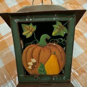 Cute metal vintage looking fall pumpkin tealight holder.